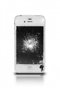 White iPhone with a cracked screen standing up