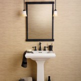 sink with a mirror and 2 hanging lights