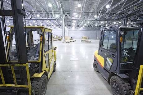 Two forklifts in a warehouse