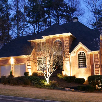 Front of a house list up with outdoor lighting
