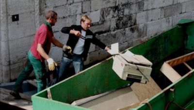 preparing the workshop by clearing out trash