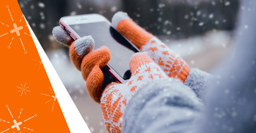 Phone being held outside while it is snowing